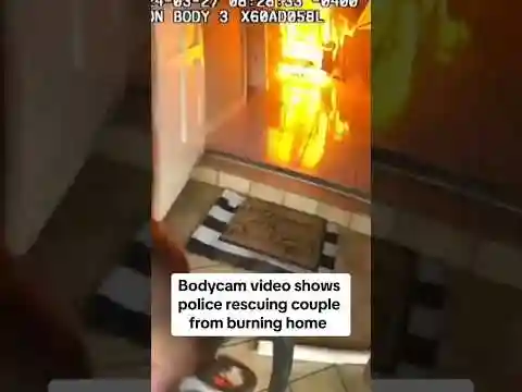 Bodycam video shows police rescuing couple from burning home #shorts