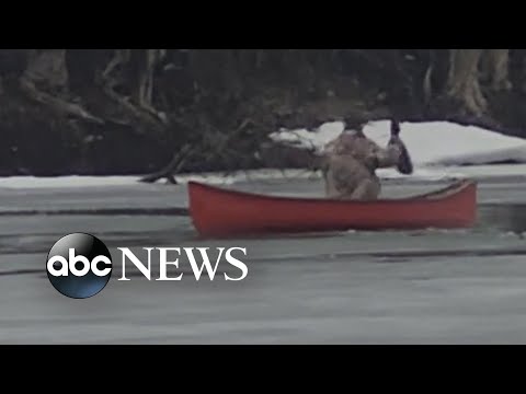 Man rescues deer from freezing river