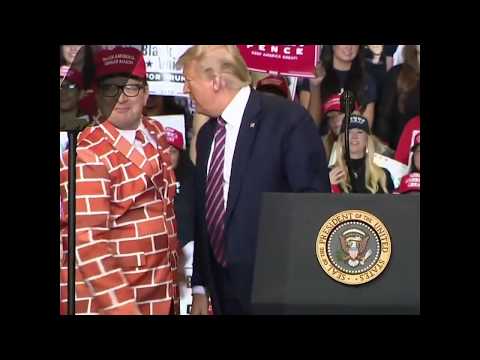 Trump invites rally attendees, including man in wall suit, onstage in Las Vegas